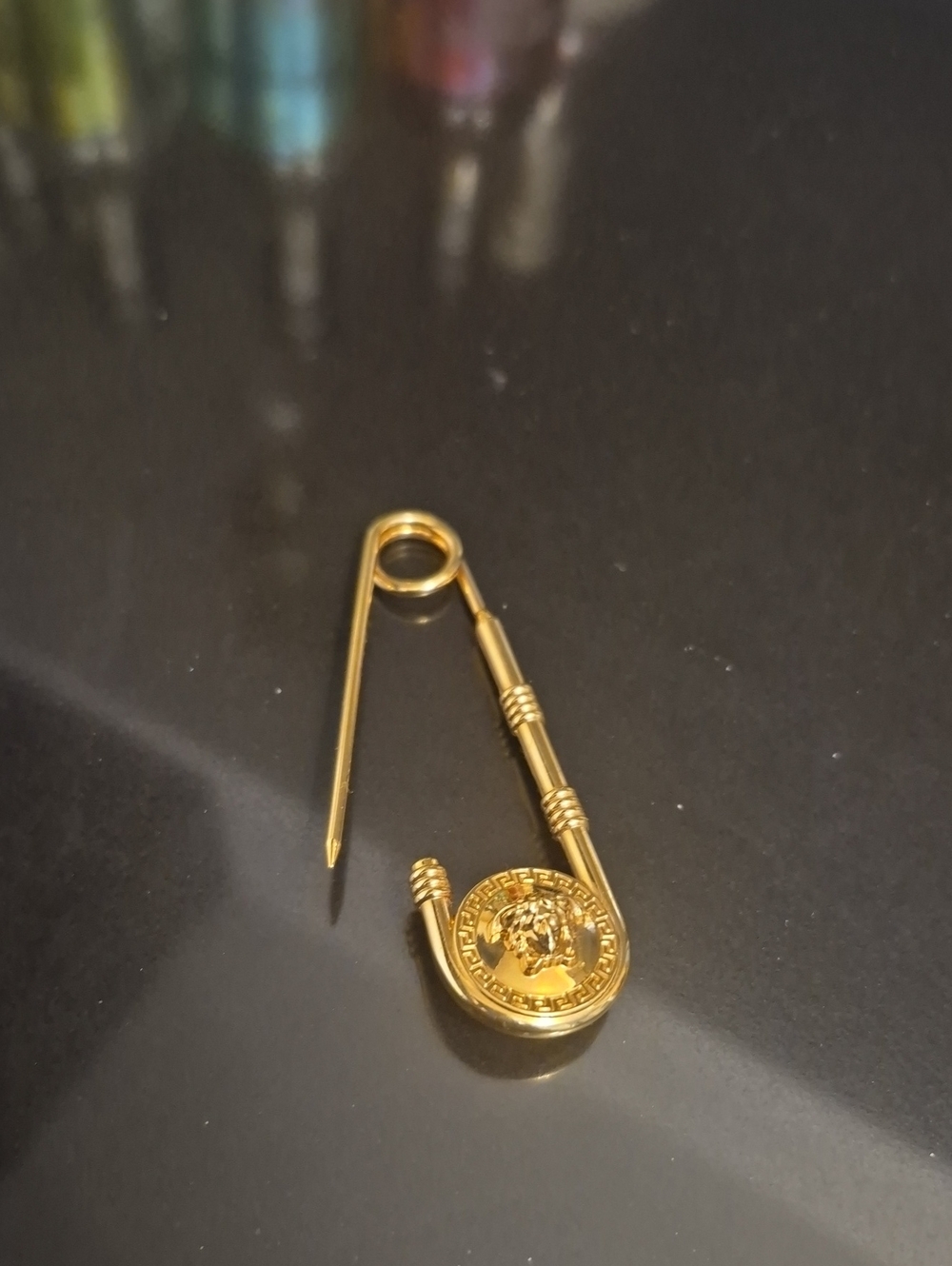 Versace Gold Safety Pin Brooch with Medallion Accent